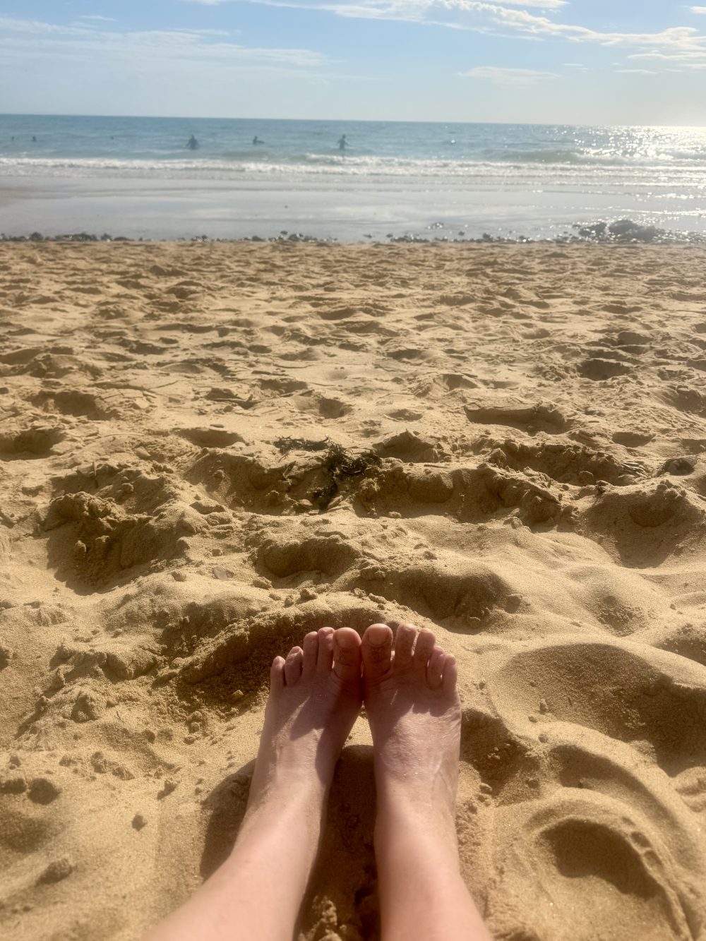 Feet on a beach