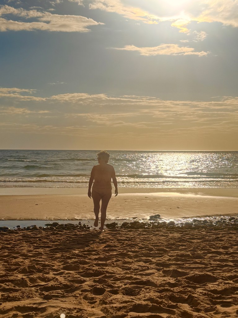 Jacqui Chaplin at the beach at sunset
